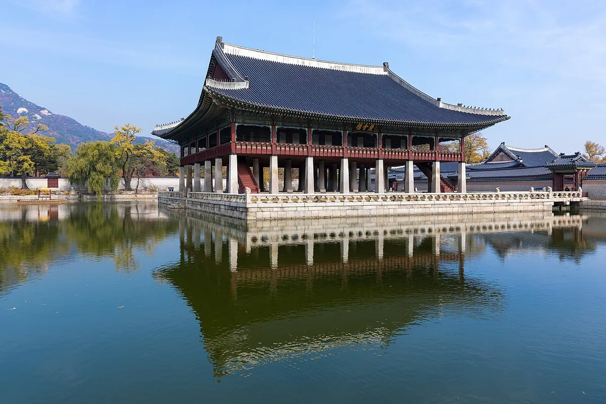 Gyeonghoeru Royal Banquet Hall stands gracefully over a tranquil pond at Gyeongbokgung Palace in Seoul.